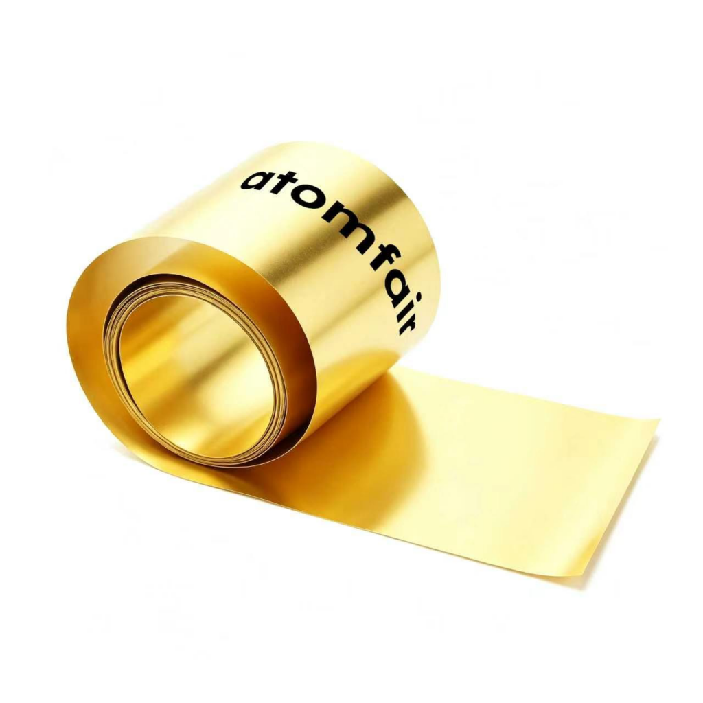 ATOMFAIR® a roll of high precision rolled brass foil showing a reflective, smooth yellow-gold metallic sheet extended flat.
