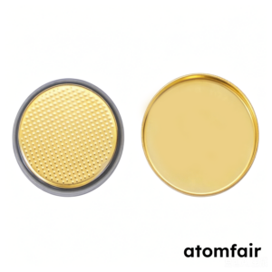 ATOMFAIR® gold titanium nitride TiN coated CR2032 coin cell cases showing textured mesh cap with black gasket and smooth bottom cup.