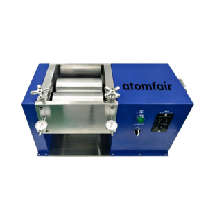 ATOMFAIR® electric rolling mill showing a blue horizontal chassis with an open metal roller section, top star handwheels, and dual dial gauges.