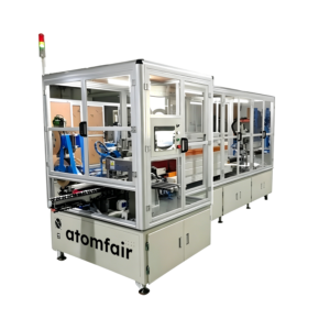 ATOMFAIR® automatic battery film wrapping machine line with a white modular aluminum frame, transparent window enclosures, and a top stack light.