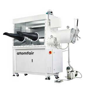 ATOMFAIR® single station inert gas glove box system featuring two protruding black rubber gloves, cylindrical antechambers, and a floor-standing vacuum pump.