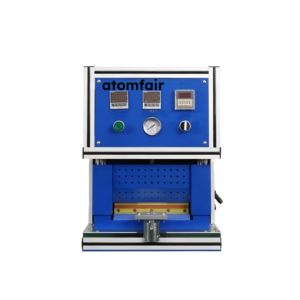 ATOMFAIR® pouch battery heat sealing machine with a blue upper control panel, digital readouts, pressure gauge, and open lower workspace.