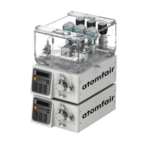 ATOMFAIR® high-pressure flow cell system featuring stacked dual fluidic pumps and an upper clear-covered gauge matrix.