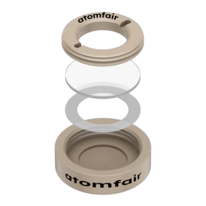 ATOMFAIR® powder sample cell exploded 3D view with circular rings, window disk, and beige base ring.