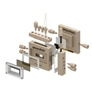 ATOMFAIR® X-ray absorption cell exploded 3D model with beige block, metal frame, seals, and fluidic connector pins.