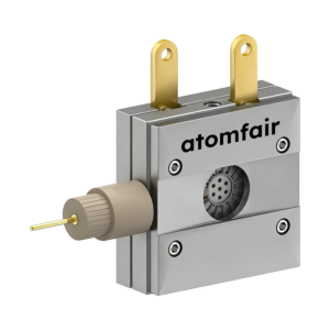 ATOMFAIR® three-electrode XRD battery cell with metallic body, two top gold tabs, and a protruding side reference pin.