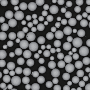 Atomfair® IN939 SLM gas turbine superalloy powder shown as dark fine granules in a transparent hexagonal glass sample bottle.