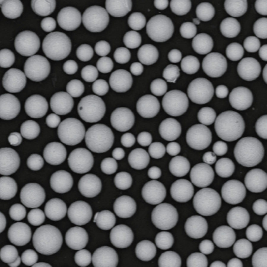 IN939 SLM Gas Turbine Superalloy Powder 1 Atomfair® IN939 SLM gas turbine superalloy powder shown as dark fine granules in a transparent hexagonal glass sample bottle.