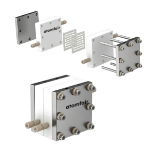 ATOMFAIR® MEA cell 3D model showing white blocks, internal channel plates, long bolts, and fully assembled unit.