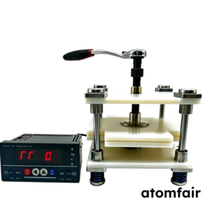 ATOMFAIR® four-layer pouch cell test fixture with off-white PP plastic plates and a mechanical wrench on a white background.
