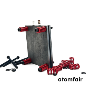 ATOMFAIR® metallic dark carbon steel basic version pouch cell battery test fixture for cycle testing on a white background