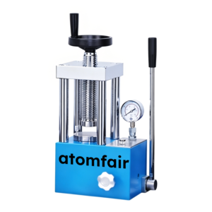 ATOMFAIR® powder tablet press machine featuring a compact body, a digital intelligent touchscreen panel, and a steel compression chamber.