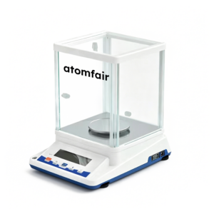 ATOMFAIR® electronic analytical balance with a transparent glass draft shield and black dimension lines on a solid white background.