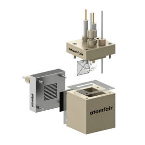 ATOMFAIR® flow cell exploded 3D view with beige main body, metal serpentine plate, and top cover with electrodes.