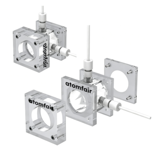 ATOMFAIR® zinc-air cell 3D model with transparent plates, circular windows, horizontal gas tubes, and assembled blocks.