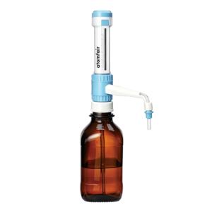 ATOMFAIR® DispensMate bottle-top dispenser mounted on an amber glass bottle for light-sensitive reagent dispensing.